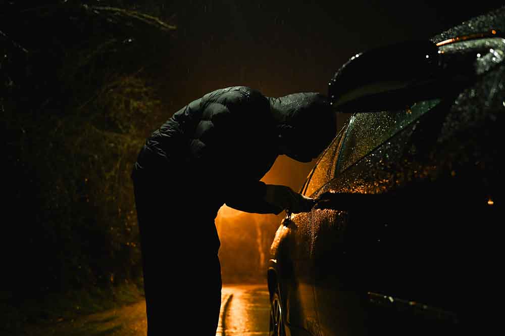 Man stealing a car.