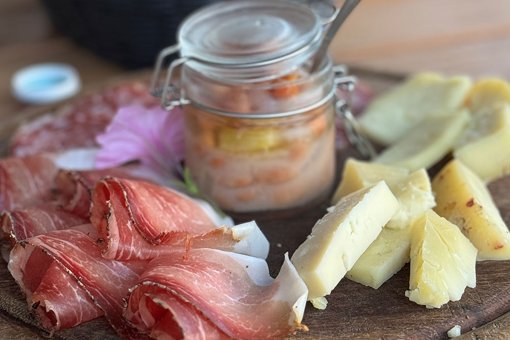Appetisers (speck, salami, cheese and beans) at Rifugio Pranolz.